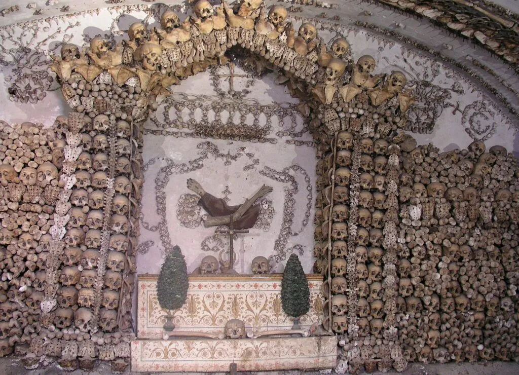 Interior view of the Capuchin Crypt in Rome, Italy, showing walls decorated with human bones