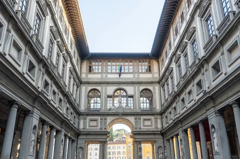 Exterior facade of famous Uffizi Galleries museum with Renaissance architecture in Florence Italy during Carpe Diem Tours art history cultural experience