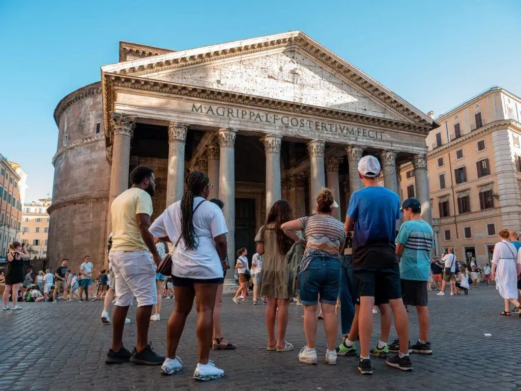 Group of tourists exploring the historic Pantheon exterior during Carpe Diem Tours Rome by Day walking tour showcasing ancient Roman architecture and cultural heritage