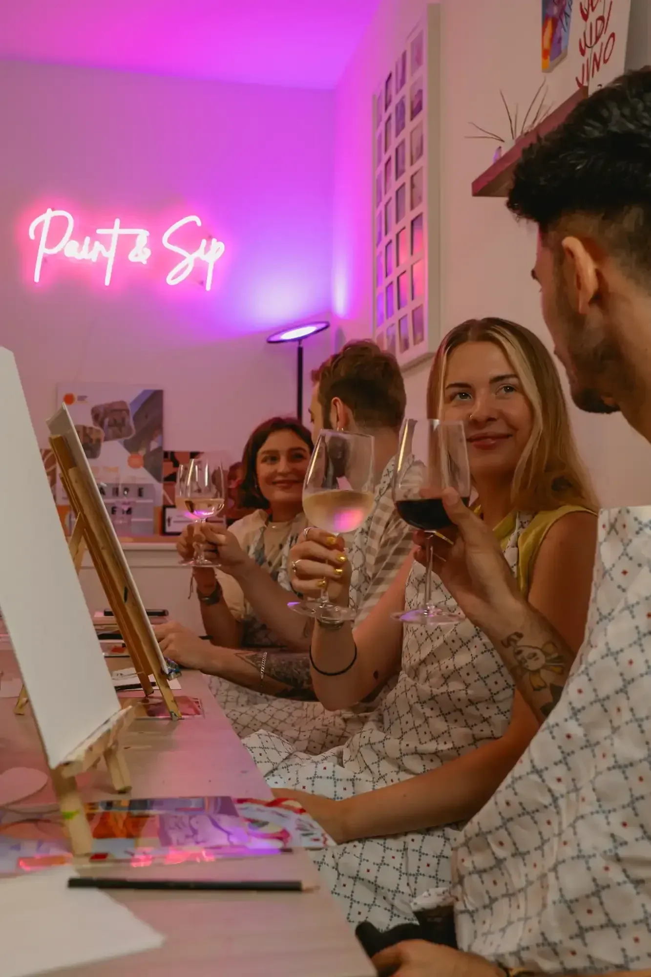 Artist painting on canvas with brushes and palette in Rome painting studio