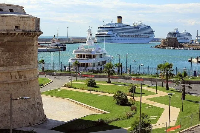 Historic fortress overlooking Civitavecchia port with cruise ships and Mediterranean Sea