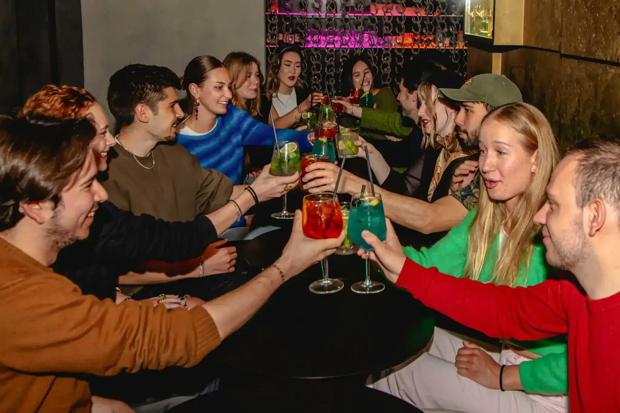 Group of travelers cheering with drinks during Florence tipsy tour
