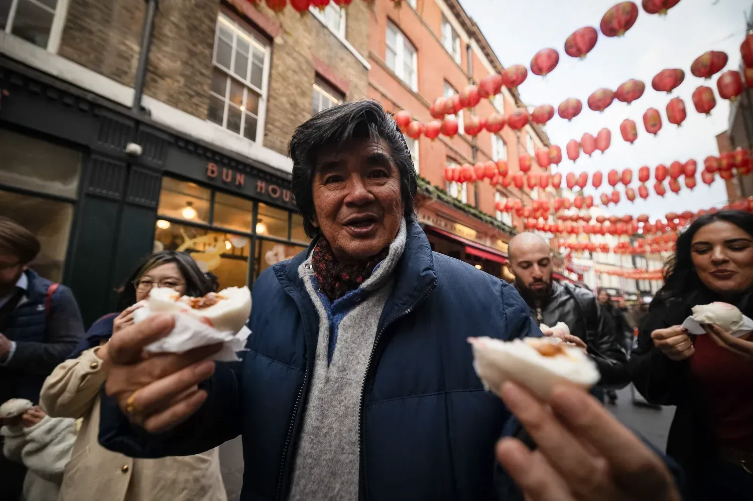 Man enjoying food and wine at outdoor London Soho Food Tour dining experience