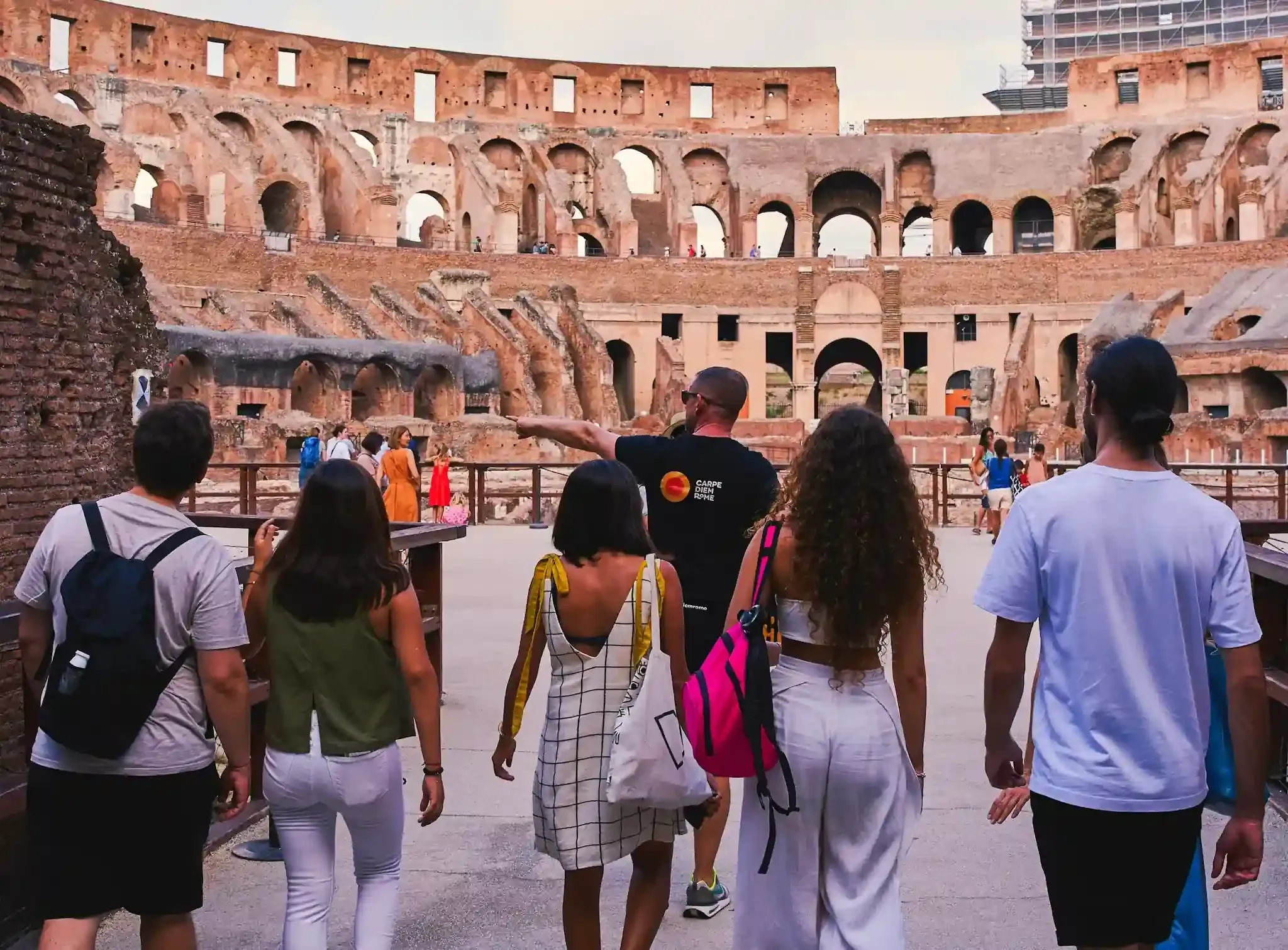 Visitors experiencing the unique arena floor access at Rome's iconic Colosseum
