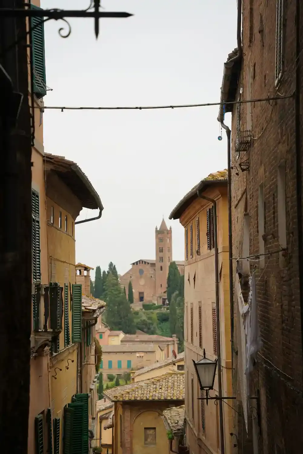 Siena Cathedral facade with distinctive black and white striped marble pattern and Renaissance architectural details